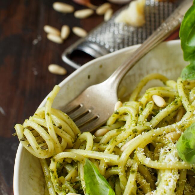 Spaghetti pasta with pesto sauce